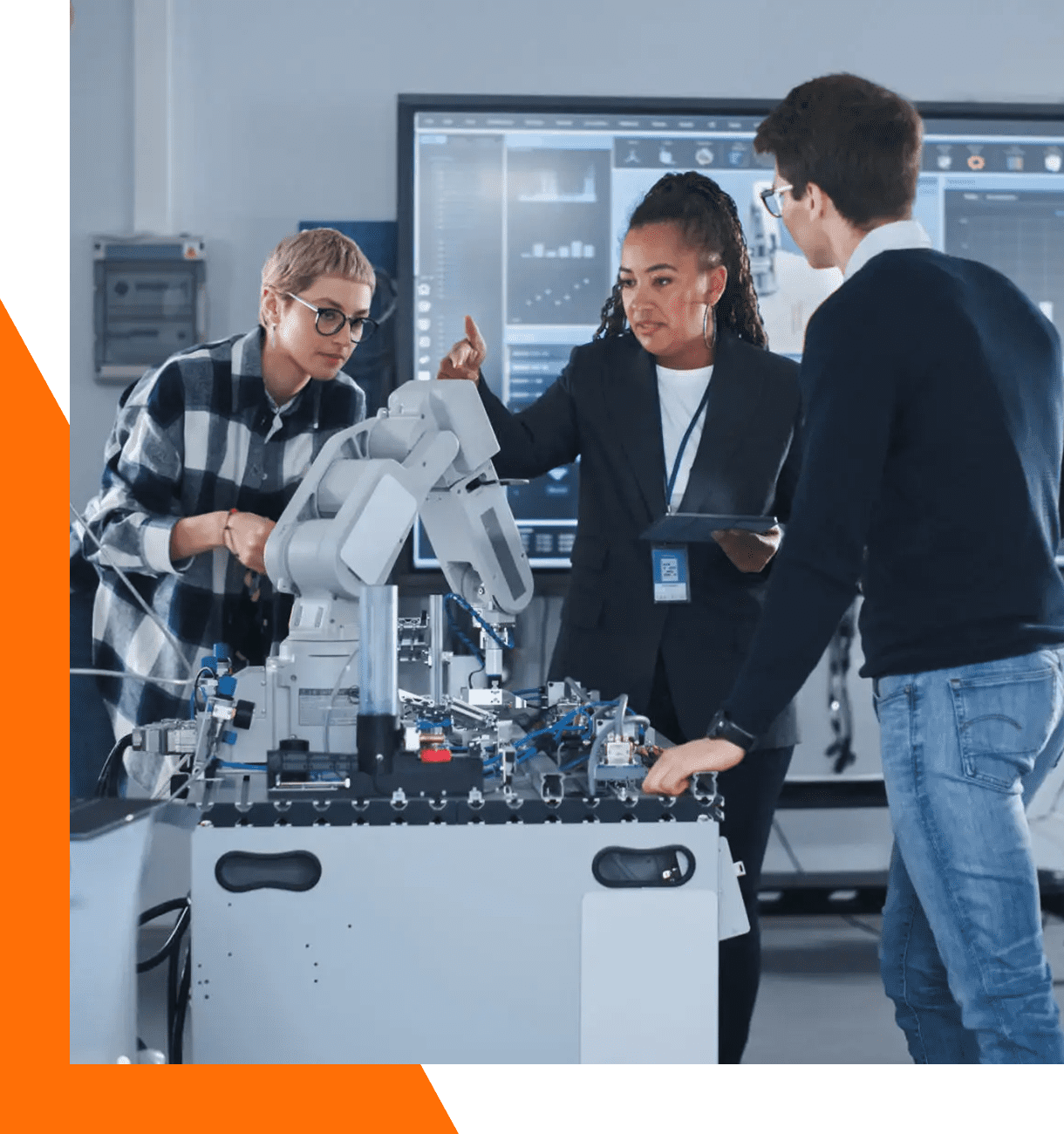 People collaborating on industrial robotic machinery.